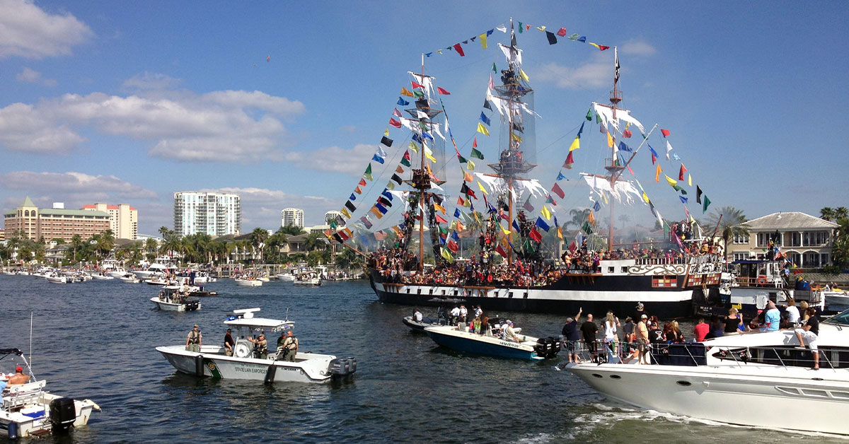 Gasparilla Pirate ship and boats approaching the Tampa Convention Center